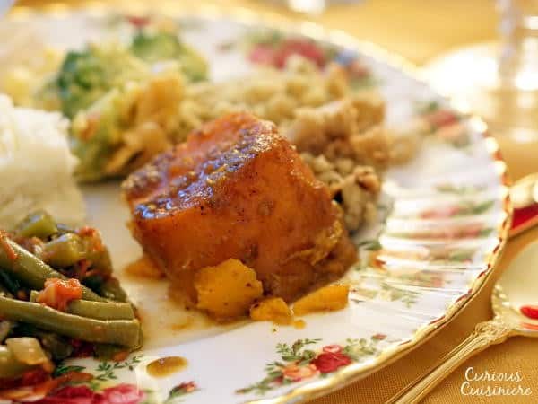 This recipe for slightly sweet, spiced and orange-flavored Candied Yams are a wonderful alternative to traditional Sweet Potato Casserole on your holiday table. |www.curiouscuisiniere.com