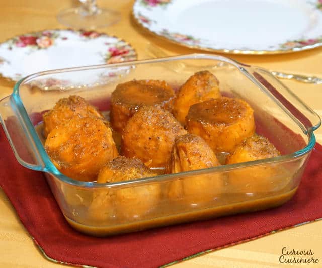 This recipe for slightly sweet, spiced and orange-flavored, Southern Candied Yams is a wonderful alternative to traditional sweet potato casserole on your holiday table. | www.CuriousCuisiniere.com
