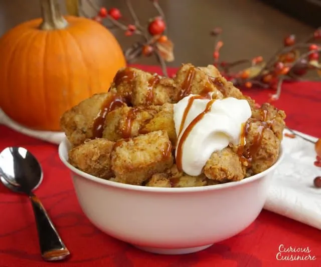 Just as good as warm pumpkin pie, this crock pot pumpkin bread pudding recipe is healthy enough for a fall breakfast, but it's enough of a treat, that it makes a wonderful dessert too! | www.CuriousCuisiniere.com