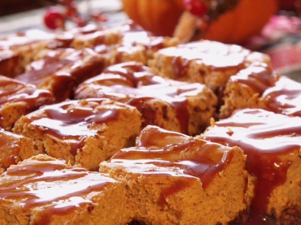 Pumpkin Cheesecake Bars | Curious Cuisiniere Bring a new dimension to a classic fall dessert recipe by transforming pumpkin pie into decadent pumpkin cheesecake bars. | www.CuriousCuisiniere.com
