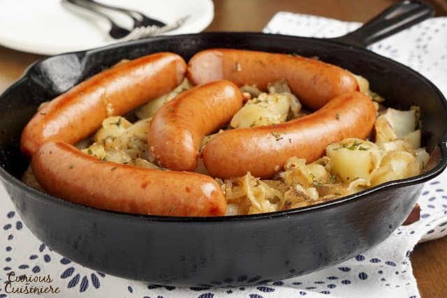 Polish Sausage and Sauerkraut are a match made in heaven. Add some potatoes and onions, and you have yourself a full meal! | www.CuriousCuisiniere.com 