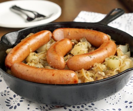 Polish Sausage and Sauerkraut are a match made in heaven. Add some potatoes and onions, and you have yourself a full meal! | www.CuriousCuisiniere.com