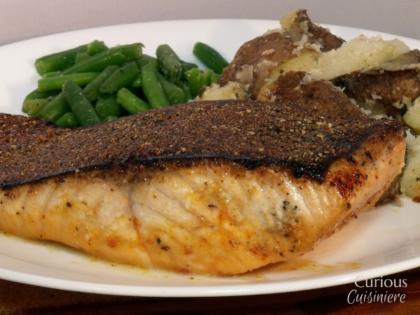 Our Cajun Blackened Salmon is bursting with robust, New Orleans flavors and finished off with a crispy garlic skin. | www.CuriousCuisiniere.com