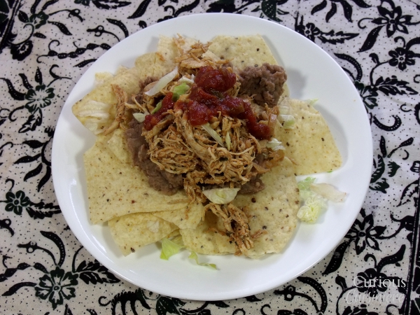 Smoky and slightly spicy, this Crock Pot Southwest Pulled Chicken is as flavorful as it is versatile and easy to make. via Curious Cuisiniere