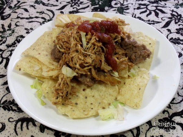 Smoky and slightly spicy, this Crock Pot Southwest Pulled Chicken is as flavorful as it is versatile and easy to make. via Curious Cuisiniere
