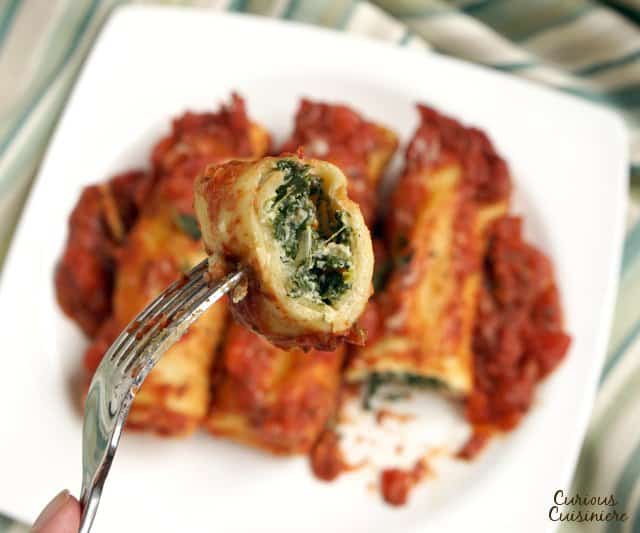 Spinach and Ricotta Cannelloni is a classic Italian stuffed pasta dish. We'll show you how to make your own easy cannelloni pasta and give you an even easier "cheat" way to make the dish! | www.CuriousCuisiniere.com 