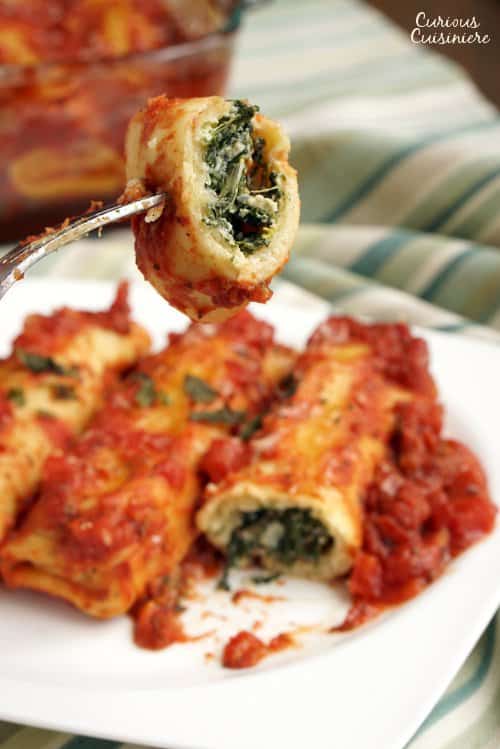 Spinach and Ricotta Cannelloni is a classic Italian stuffed pasta dish. We'll show you how to make your own easy cannelloni pasta and give you an even easier "cheat" way to make the dish! | www.CuriousCuisiniere.com 