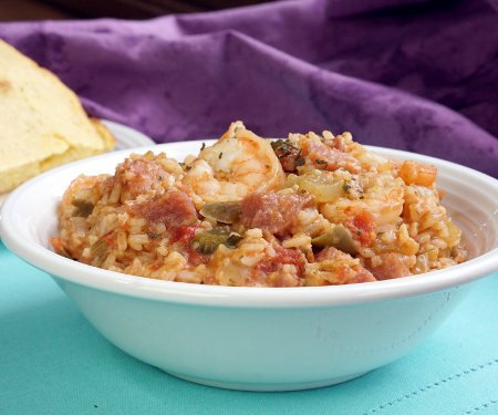 Shrimp and Ham Creole Jambalaya is a hearty and flavorful dish that is perfect for Mardi Gras or any time you want a taste of New Orleans! | www.CuriousCuisiniere.com