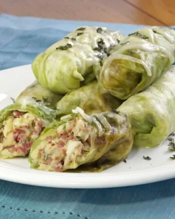 These Corned Beef Cabbage Rolls bring all the fixings of a Corned Beef Dinner into cute little bundles. They're a great way to use up St. Patrick's Day leftovers! | www.CuriousCuisiniere.com