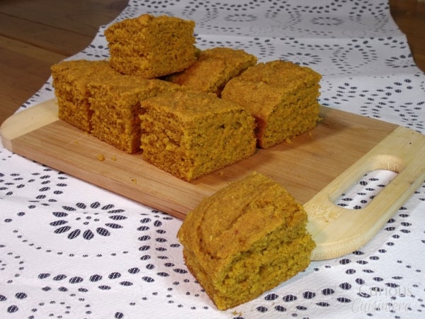 A deeply flavorful and moist pumpkin cornbread, this recipe for Pumpkin Cornbread makes a great addition to a hearty winter meal or a nice fall snack all on its own. | Curious Cuisiniere