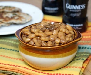 Not your classic sweet and sticky BBQ Baked Beans, these Guinness Baked Beans boast a mild and malty sweetness with a deep and robust flavor. | www.CuriousCuisiniere.com