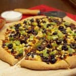 This Cornmeal Pizza Crust recipe is quick and easy to make. Load up your Mexican Pizza with your favorite Mexican inspired toppings for an easy weeknight meal! | www.CuriousCuisiniere.com