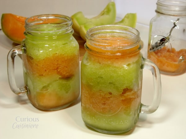 This layered Melon Granita combines brightly colored layers of sweet honeydew granita and spiced cantaloupe granita make a sweet, guilt free summer treat. | Curious Cuisiniere