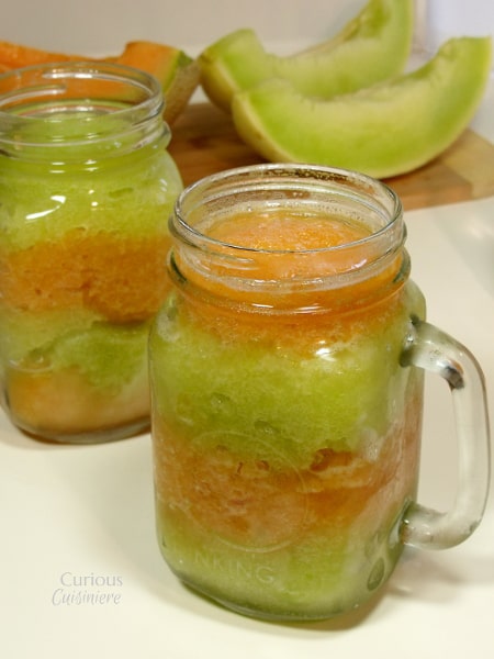 This layered Melon Granita combines brightly colored layers of sweet honeydew granita and spiced cantaloupe granita make a sweet, guilt free summer treat. | Curious Cuisiniere