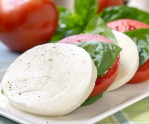 Insalata Caprese (or Caprese Salad) with juicy tomatoes, fresh basil, and soft mozzarella cheese. | www.CuriousCuisiniere.com