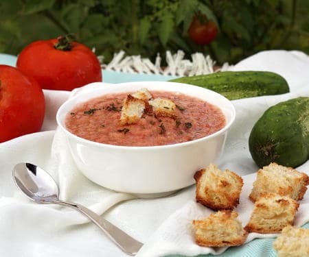 There is more than meets the eye to this chilled, Spanish soup. Gazpacho is a refreshing and flavorful chance to serve up summer in a bowl! | www.CuriousCuisiniere.com