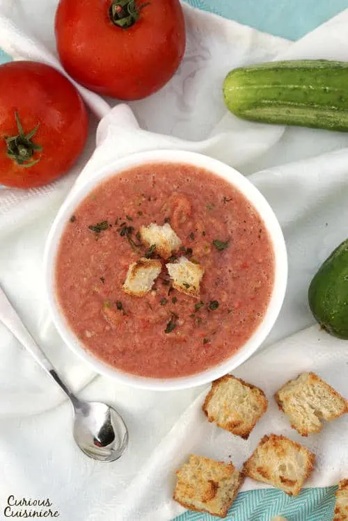 There is more than meets the eye to this chilled, Spanish soup. Gazpacho is a refreshing and flavorful chance to serve up summer in a bowl! | www.CuriousCuisiniere.com