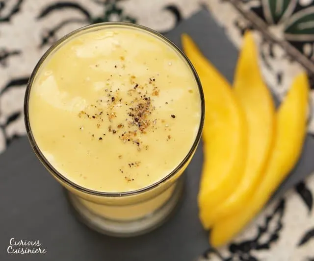 This refreshing Mango Lassi recipe is a simple way to create a traditional Indian drink made from fresh mango. | www.CuriousCuisiniere.com