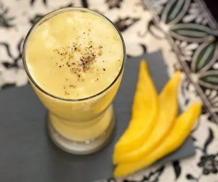 This refreshing Mango Lassi recipe is a simple way to create a traditional Indian drink made from fresh mango. | www.CuriousCuisiniere.com