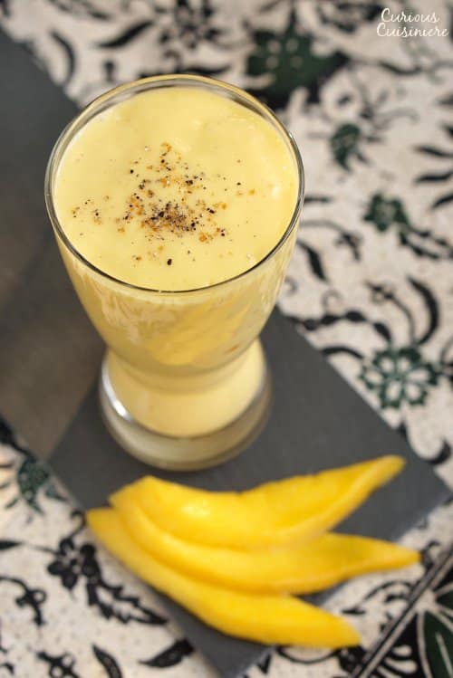 This refreshing Mango Lassi recipe is a simple way to create a traditional Indian drink made from fresh mango. | www.CuriousCuisiniere.com