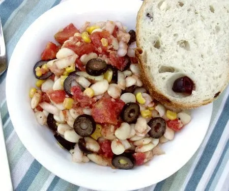 Mediterranean Lima Bean Succotash is a fusion dish that combines Lima beans and corn with Mediterranean herbs to create a summery twist on a classic succotash. | www.CuriousCuisiniere.com