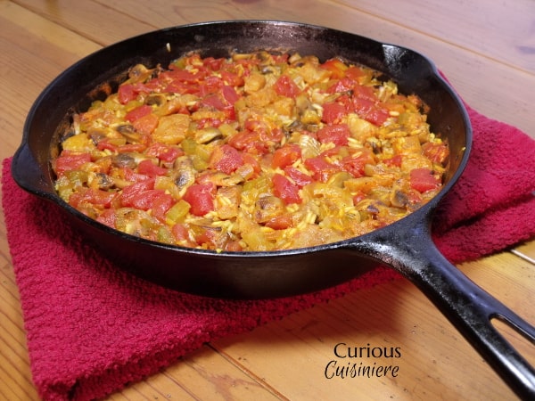 This tasty Mushroom and White Fish Paella is full of veggies with just a light touch of seafood, for those who aren't quite ready to tackle a full out seafood paella. | Curious Cuisiniere