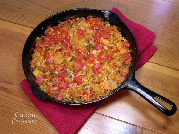 This tasty Mushroom and White Fish Paella is full of veggies with just a light touch of seafood, for those who aren't quite ready to tackle a full out seafood paella. | Curious Cuisiniere