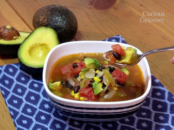 Mexican Minestrone with Avocados from Curious Cuisiniere - This Mexican Vegetable Soup uses healthy avocados for added nutrition and a creamy texture. We're calling it Mexican Minestrone for a fun fusion!