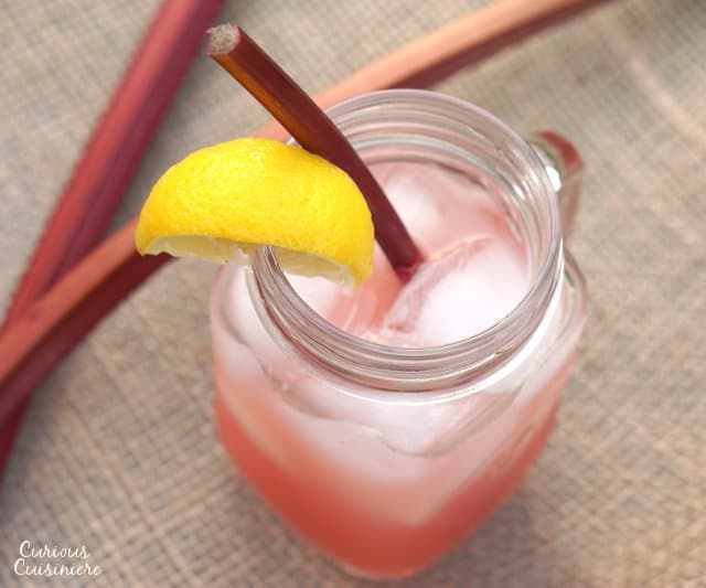 This Rhubarb Lemonade brings a unique sweet and tart twist to the refreshing summer classic drink. | www.CuriousCuisiniere.com