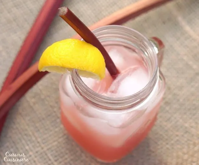 This Rhubarb Lemonade brings a unique sweet and tart twist to the refreshing summer classic drink. | www.CuriousCuisiniere.com