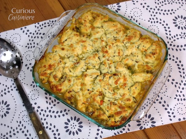 This flavorful turkey pot pie recipe has a surprise in the crust: garlic, bacon, cheddar biscuits! What a perfect way to use up leftover holiday turkey! | Curious Cuisiniere