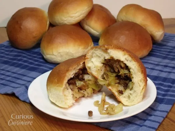 The flavorful beef and cabbage stuffed in a fluffy roll makes German Bierocks the perfect hand-held food to go along with your Oktoberfest beer. | Curious Cuisiniere