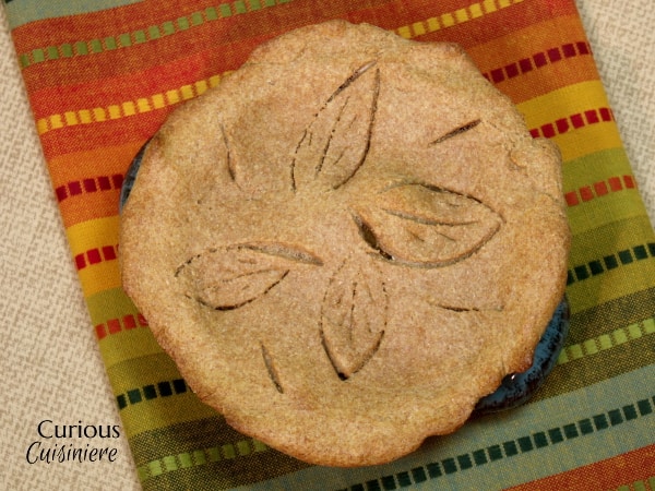 A hearty vegetarian pot pie filled with sweet and nutty butternut squash and earthy lentils. Perfect for a cool fall evening. | www.CuriousCuisiniere.com