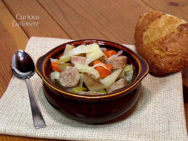 Bratwurst, potatoes, cabbage, and carrots mingle in this hearty Slow Cooker Oktoberfest Stew that gets an extra pump of flavor from a good dose of German beer. | www.curiouscuisiniere.com Oktoberfest Stew from Curious Cuisiniere