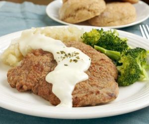 Country Fried Venison Steak with broccoli and mashed potatoes.