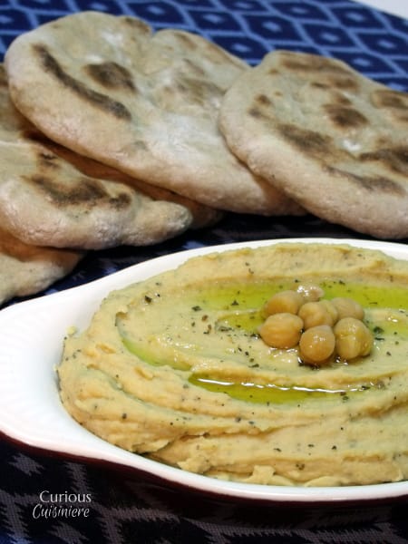 In this Spicy Oregano Hummus, oregano adds a rich herby-ness and a splash of hot sauce gives a slight kick. It's the perfect, unique way to use oregano! | Curious Cuisiniere