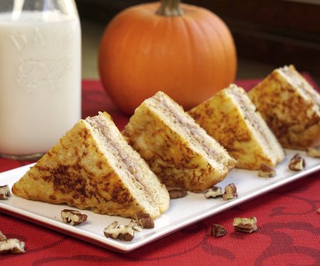 Pumpkin pie becomes the perfect, elegant fall breakfast with this recipe for Pumpkin Stuffed French Toast. | www.CuriousCuisiniere.com