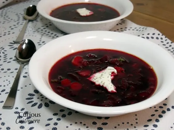 Our Polish Borscht recipe (Barszcz) is chock full of veggies and boasts a bright, sweet and sour flavor that makes it a perfect first course or warming meal. | Curious Cuisiniere