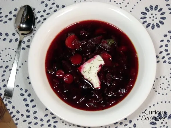 Our Polish Borscht recipe (Barszcz) is chock full of veggies and boasts a bright, sweet and sour flavor that makes it a perfect first course or warming meal. | Curious Cuisiniere