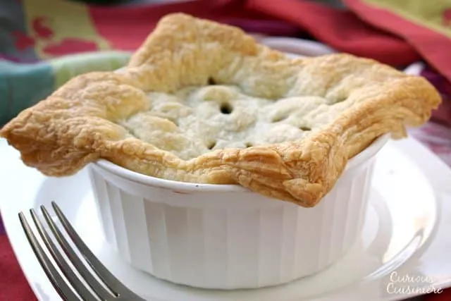 These individual Beef Burgundy Pot Pies evoke all the slow-cooked flavor of a traditional French Boeuf Bourguignon, with an added flaky pastry top! | www.CuriousCuisiniere.com