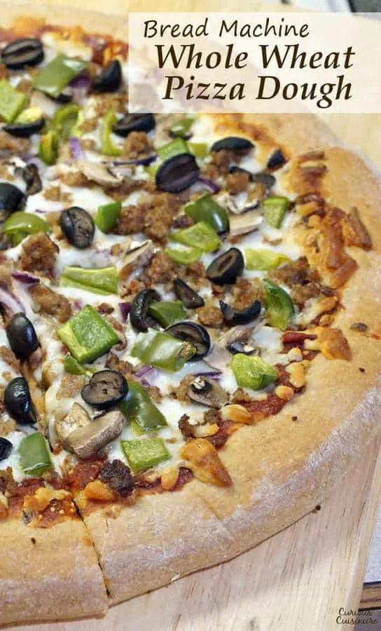 Making pizza is incredibly simple when you break out your bread machine! This Bread Machine Whole Wheat Pizza Dough recipe is so easy, you'll want homemade pizza every night!  | www.CuriousCuisiniere.com