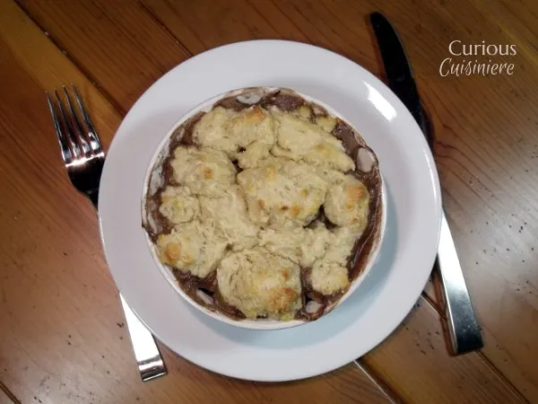 These individual Beef Burgundy Pot Pies evoke all the slow-cooked flavor of a traditional French Boeuf Bourguignon, with an added biscuit topping! | Curious Cuisiniere