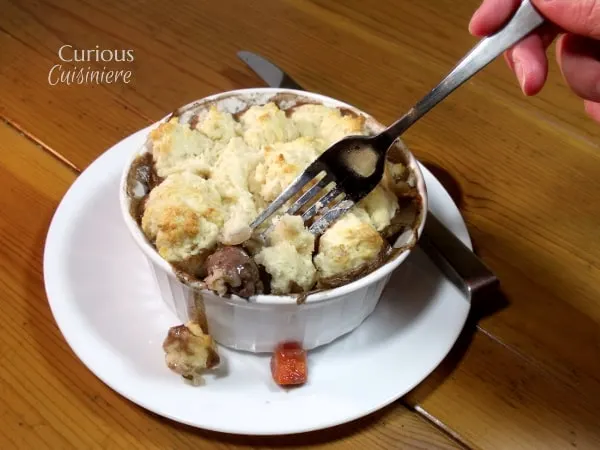 These individual Beef Burgundy Pot Pies evoke all the slow-cooked flavor of a traditional French Boeuf Bourguignon, with an added biscuit topping! | Curious Cuisiniere