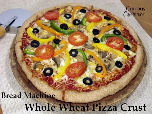 This Bread Machine Whole Wheat Pizza Dough recipe is so simple, you'll want homemade pizza every night! | Curious Cuisiniere