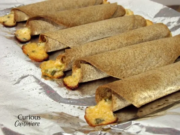 Jalapeno Popper Taquitos from Curious Cuisiniere Cream cheese and jalapeno give these Jalapeno Popper Taquitos the creamy and spice combo you love, all rolled into crispy homemade taquitos. | Curious Cuisiniere
