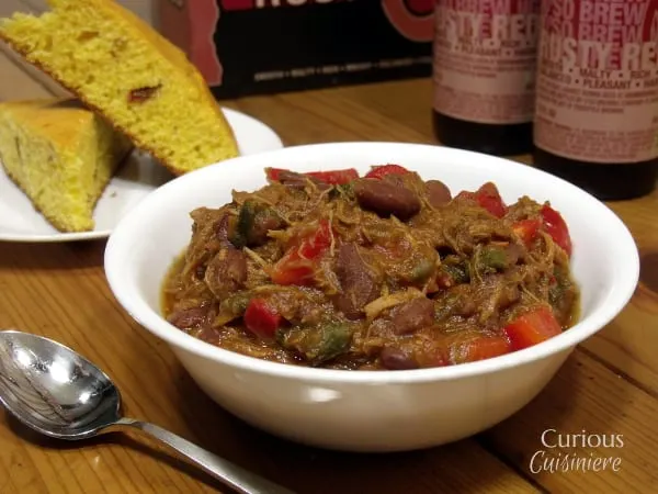This Pulled Pork Chili uses fresh ingredients to give it a sweet and spicy flavor. You'd never guess it was an apple chili! | Curious Cuisiniere