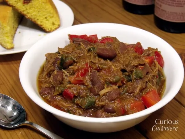 This Pulled Pork Chili uses fresh ingredients to give it a sweet and spicy flavor. You'd never guess it was an apple chili! | Curious Cuisiniere