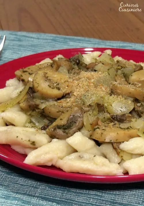 Kopytka are Polish potato dumplings that could be called Poland's version of Italian Gnocchi. The two dishes are very similar in all ways except for their toppings. | www.CuriousCuisiniere.com