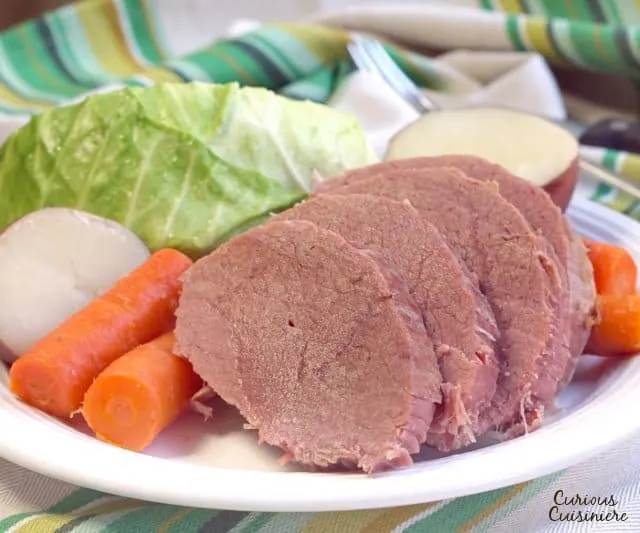 While it might not be an Irish dish, Corned Beef and Cabbage has become the staple dish of St. Patrick's Day. Find out why! | www.CuriousCuisiniere.com