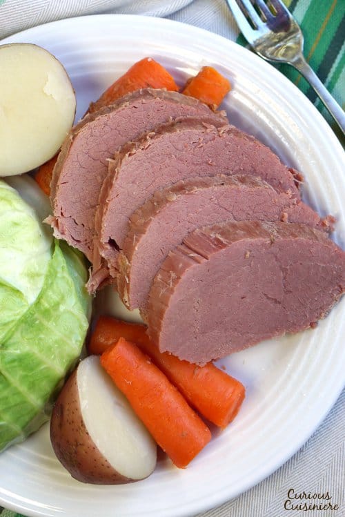 While it might not be an Irish dish, Corned Beef and Cabbage has become the staple dish of St. Patrick's Day. Find out why! | www.CuriousCuisiniere.com